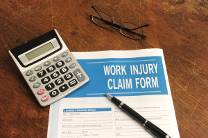 insurance: blank work injury claim form on desk ** Note: Shallow depth of field