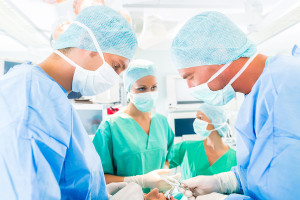 Hospital - surgery team in operating room or Op of a clinic oper